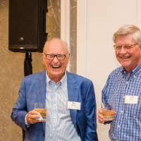 Two guests laughing together at Naples 2019